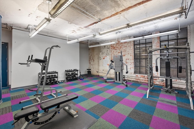 1122 Jackson St Unit 418, Dallas, TX 75202 - exercise room with carpet floors and baseboards