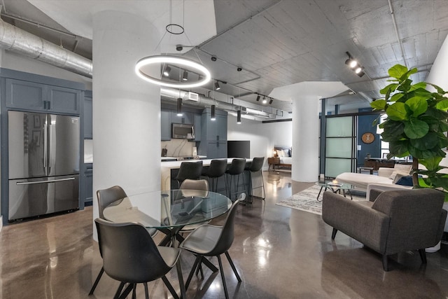 1122 Jackson St Unit 418, Dallas, TX 75202 - dining room featuring concrete flooring