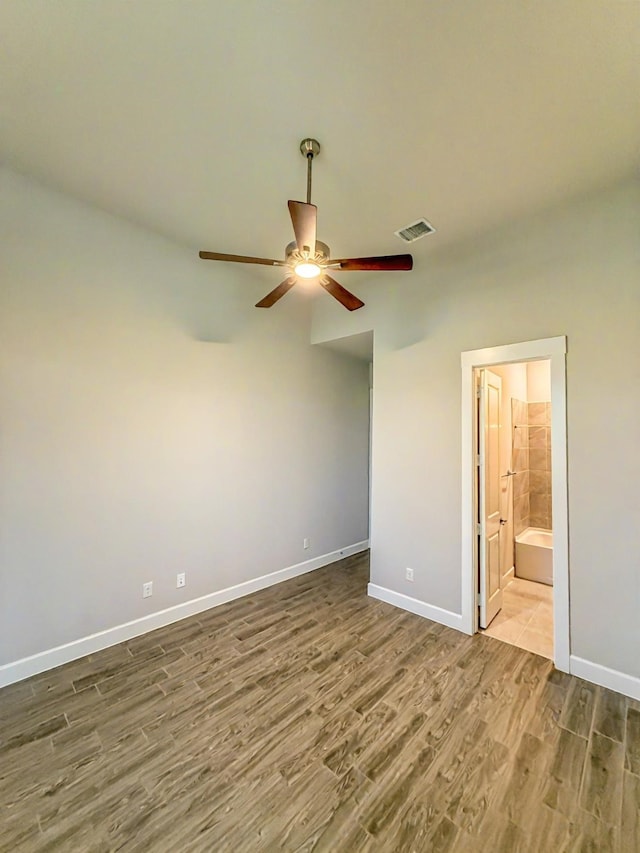 9714 Minister Ln, Frisco, TX 75035 - unfurnished bedroom with wood finished floors, ensuite bath, and ceiling fan