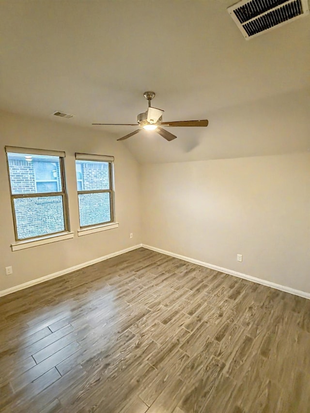 9714 Minister Ln, Frisco, TX 75035 - unfurnished room with dark wood finished floors, lofted ceiling, and a ceiling fan