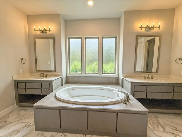 9714 Minister Ln, Frisco, TX 75035 - full bath with marble finish flooring, two vanities, a bath, and recessed lighting