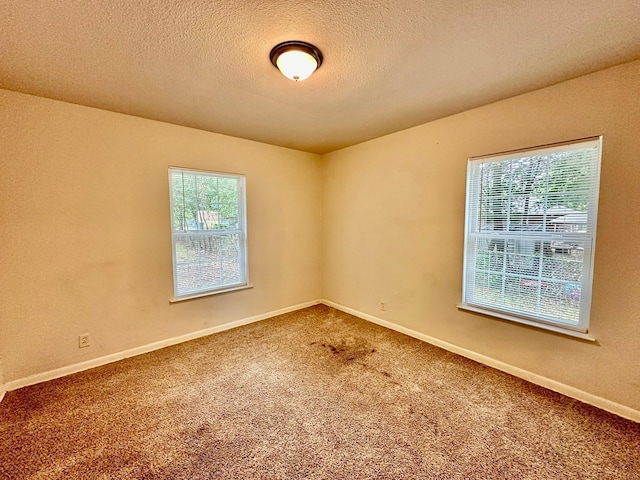 513 N Maple St, Sherman, TX 75092 - carpeted empty room featuring a textured ceiling and baseboards