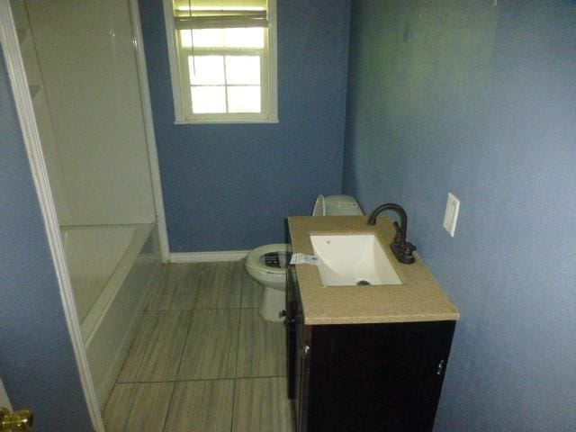 408 Soward Ave, Weatherford, TX 76086 - full bathroom with vanity, tile patterned flooring, and  shower combination