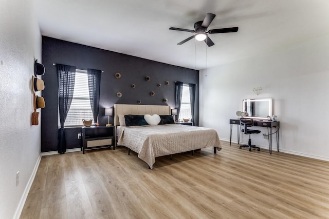 7113 Wavecrest Way, Fort Worth, TX 76179 - bedroom featuring wood finished floors, multiple windows, and a ceiling fan