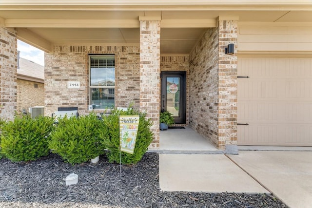 7113 Wavecrest Way, Fort Worth, TX 76179 - view of exterior entry with a garage and covered porch