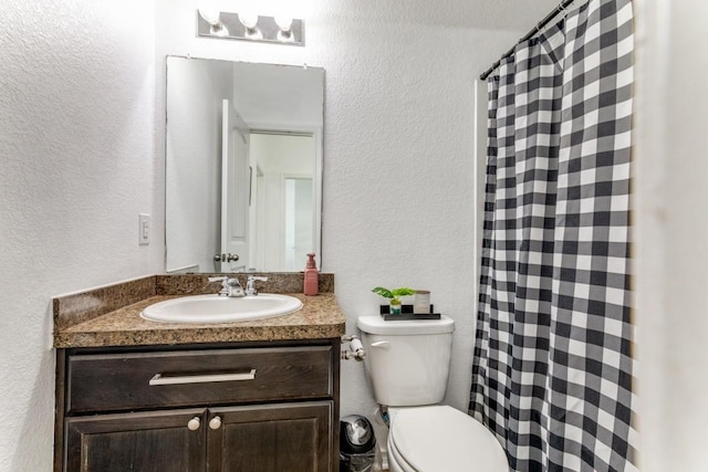 7113 Wavecrest Way, Fort Worth, TX 76179 - full bath featuring a textured wall, vanity, and a shower with curtain