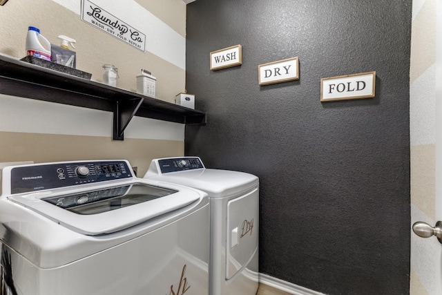 7113 Wavecrest Way, Fort Worth, TX 76179 - washroom with separate washer and dryer and a textured wall