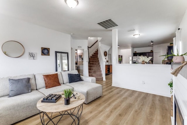 7113 Wavecrest Way, Fort Worth, TX 76179 - living area featuring light wood finished floors and stairs