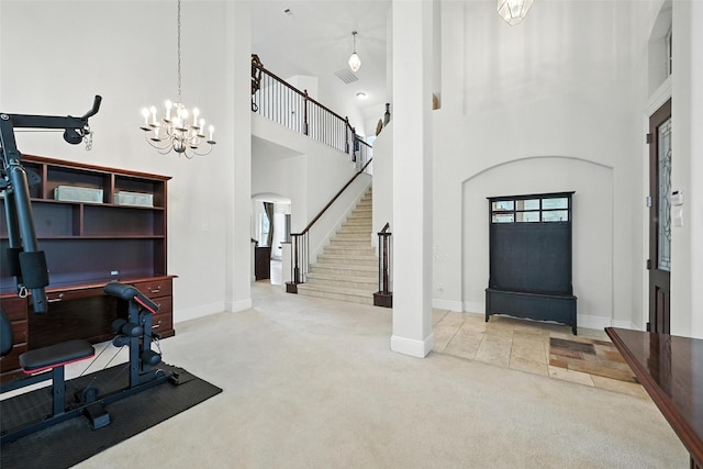 890 Wind Brook Ln, Prosper, TX 75078 - entrance foyer with carpet floors, a towering ceiling, a chandelier, stairway, and arched walkways