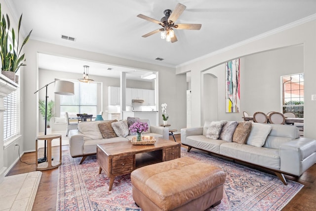 1413 Trinity Ct, Flower Mound, TX 75028 - living area featuring wood finished floors, ceiling fan, plenty of natural light, and crown molding