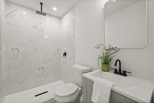 1843 Trent Dr, Arlington, TX 76010 - bathroom featuring vanity, tiled shower, and recessed lighting