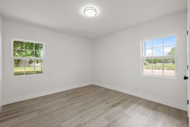 1843 Trent Dr, Arlington, TX 76010 - spare room with healthy amount of natural light and light wood finished floors