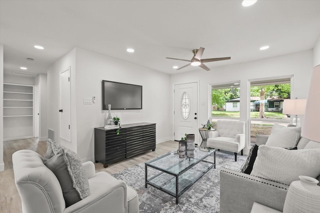 1843 Trent Dr, Arlington, TX 76010 - living room featuring light wood finished floors, recessed lighting, and a ceiling fan