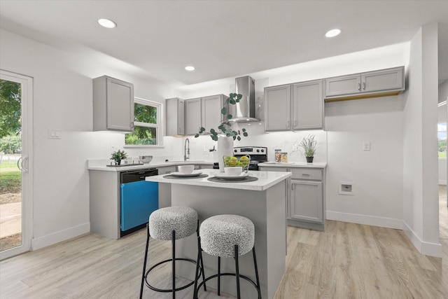 1843 Trent Dr, Arlington, TX 76010 - kitchen with wall chimney range hood, dishwasher, gray cabinets, light countertops, and a center island