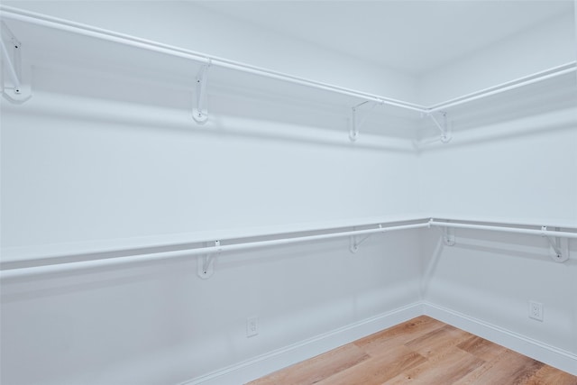 9311 Mercer Dr, Dallas, TX 75228 - spacious closet featuring light wood finished floors