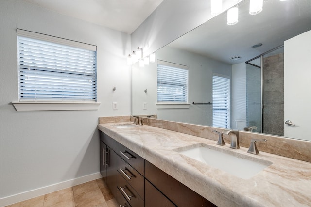 5816 Birchbrook Dr Unit 122, Dallas, TX 75206 - full bathroom featuring double vanity, a tile shower, and tile patterned floors
