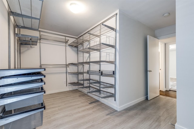5816 Birchbrook Dr Unit 122, Dallas, TX 75206 - spacious closet featuring wood finished floors