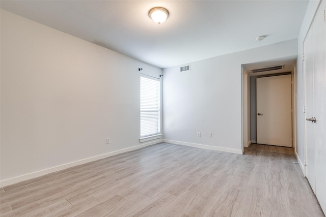 5816 Birchbrook Dr Unit 122, Dallas, TX 75206 - empty room featuring light wood-type flooring and a smoke detector