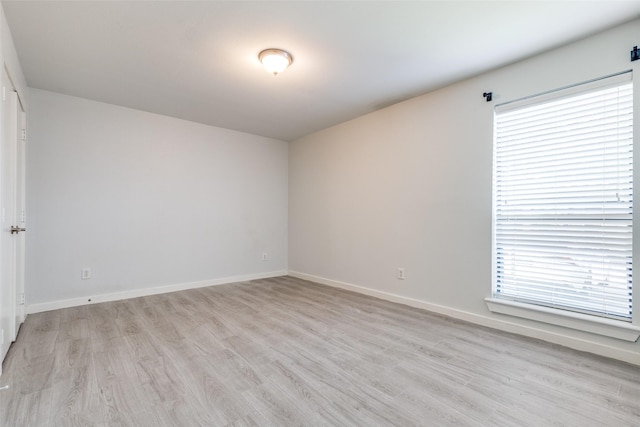 5816 Birchbrook Dr Unit 122, Dallas, TX 75206 - spare room with light wood finished floors