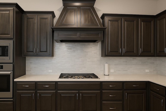 617 Saragosa Ct, Mckinney, TX 75071 - kitchen featuring premium range hood, stainless steel appliances, dark brown cabinetry, and light countertops