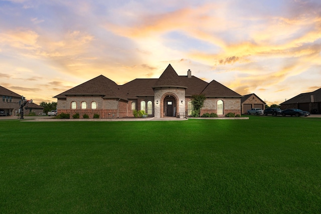 11088 Whispering Ln, Talty, TX 75126 - french country style house with brick siding, a lawn, and a chimney