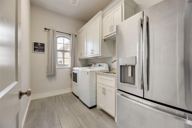 11088 Whispering Ln, Talty, TX 75126 - washroom featuring washing machine and dryer and cabinet space