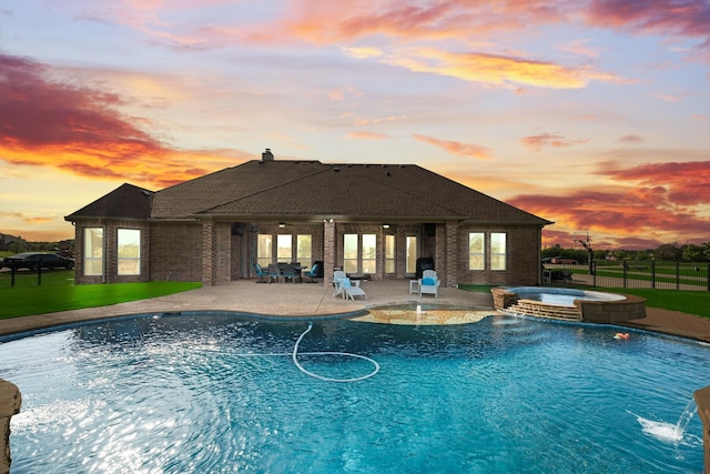 11088 Whispering Ln, Talty, TX 75126 - pool at dusk featuring a patio area and a pool with connected hot tub