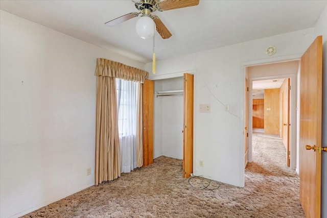 509 Lipscomb St, Bonham, TX 75418 - unfurnished bedroom with carpet floors, a closet, and a ceiling fan