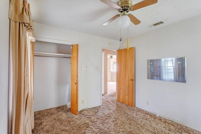 509 Lipscomb St, Bonham, TX 75418 - unfurnished bedroom with carpet, a closet, and ceiling fan