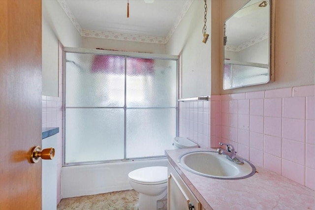 509 Lipscomb St, Bonham, TX 75418 - full bath featuring vanity, enclosed tub / shower combo, and a wainscoted wall