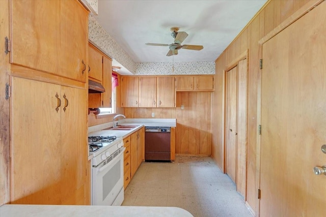 509 Lipscomb St, Bonham, TX 75418 - kitchen with dishwashing machine, white gas stove, under cabinet range hood, light flooring, and a ceiling fan