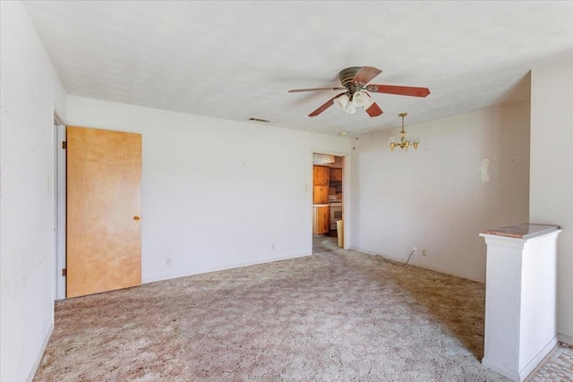 509 Lipscomb St, Bonham, TX 75418 - empty room featuring a chandelier, carpet floors, and ceiling fan