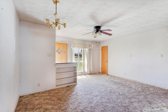 509 Lipscomb St, Bonham, TX 75418 - carpeted spare room featuring a chandelier and ceiling fan