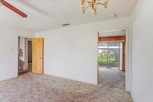 509 Lipscomb St, Bonham, TX 75418 - unfurnished room featuring carpet flooring and a chandelier