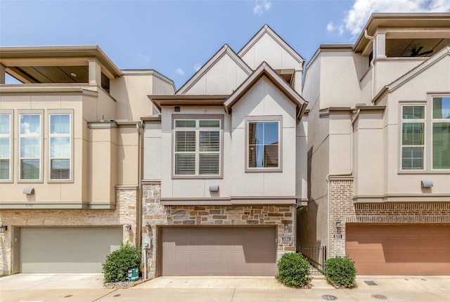 5184 Brickellia, Dallas, TX 75209 - multi unit property with stucco siding, an attached garage, concrete driveway, and stone siding