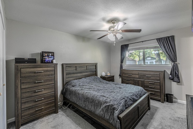 3401 Medallion Cir, Waco, TX 76706 - bedroom featuring light carpet, a ceiling fan, and a textured ceiling