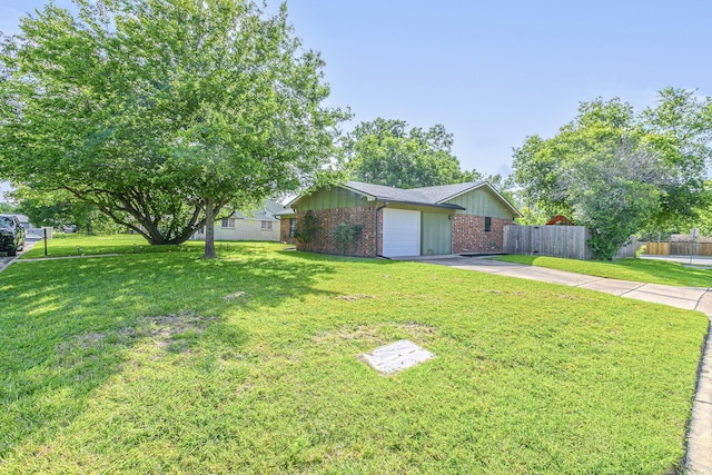 3401 Medallion Cir, Waco, TX 76706 - view of front of property featuring concrete driveway, brick siding, a garage, and board and batten siding