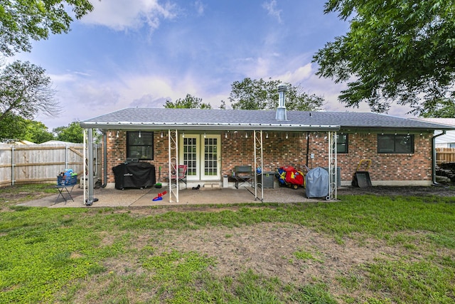 3401 Medallion Cir, Waco, TX 76706 - rear view of property with french doors, a patio, and brick siding