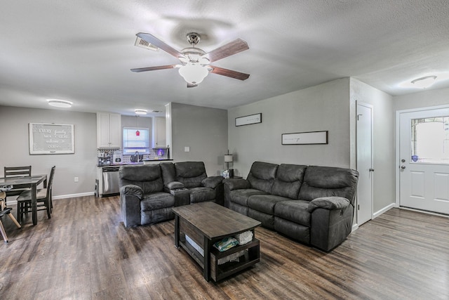 3401 Medallion Cir, Waco, TX 76706 - living area with dark wood-type flooring, ceiling fan, and a textured ceiling
