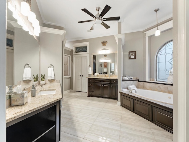 2 Pond View Ct, Mansfield, TX 76063 - bathroom featuring a garden tub, ornamental molding, a ceiling fan, two vanities, and tile patterned flooring