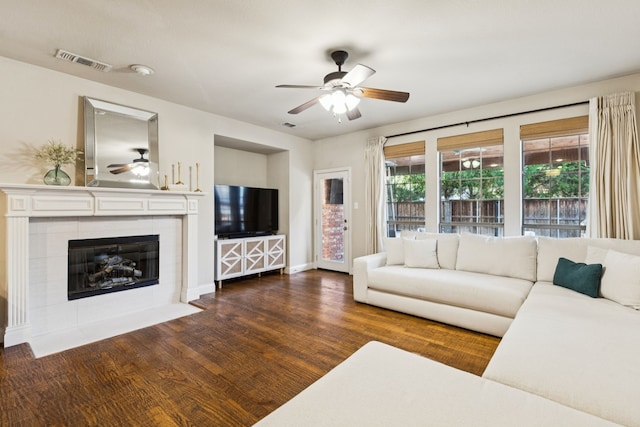 2778 Hidden Knoll Trl, Frisco, TX 75034 - living room featuring ceiling fan, wood finished floors, and a tile fireplace