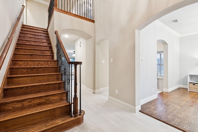 2778 Hidden Knoll Trl, Frisco, TX 75034 - stairs with arched walkways and ornamental molding