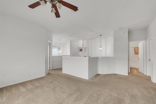5805 Cobalt Ln, Killeen, TX 76542 - unfurnished living room featuring light colored carpet, a ceiling fan, and a chandelier