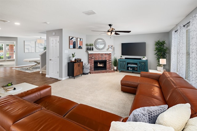 2115 Highland River Dr, Wylie, TX 75098 - living room with ceiling fan, recessed lighting, and a brick fireplace