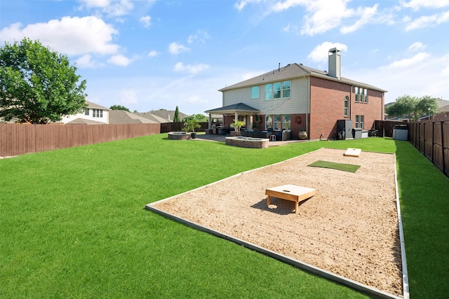 2115 Highland River Dr, Wylie, TX 75098 - fenced backyard with a fire pit and a patio area