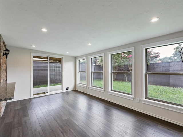 2032 Christie Ln, Carrollton, TX 75007 - unfurnished living room featuring recessed lighting and dark wood-style floors