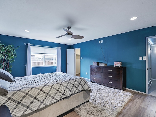 2032 Christie Ln, Carrollton, TX 75007 - bedroom with wood finished floors, ceiling fan, a spacious closet, recessed lighting, and a closet