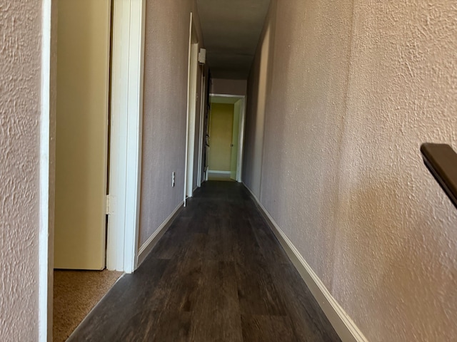711 Ticonderoga Dr, Garland, TX 75043 - hallway featuring wood finished floors and a textured wall
