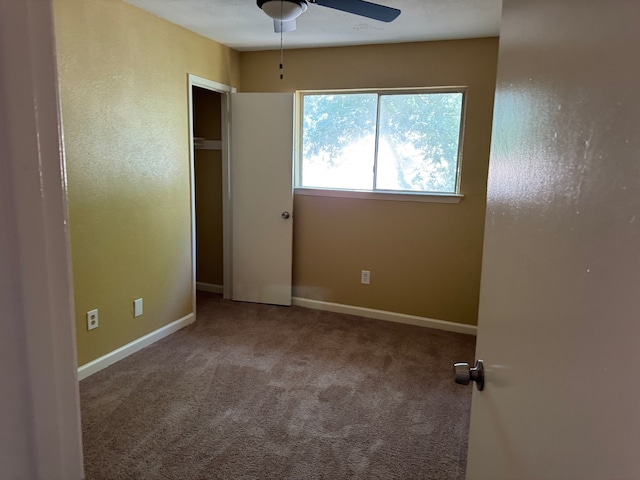 711 Ticonderoga Dr, Garland, TX 75043 - unfurnished bedroom featuring carpet floors and a ceiling fan