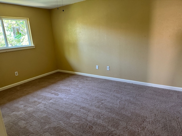 711 Ticonderoga Dr, Garland, TX 75043 - unfurnished room with baseboards and carpet flooring